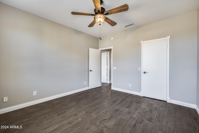 unfurnished bedroom with ceiling fan and dark hardwood / wood-style floors