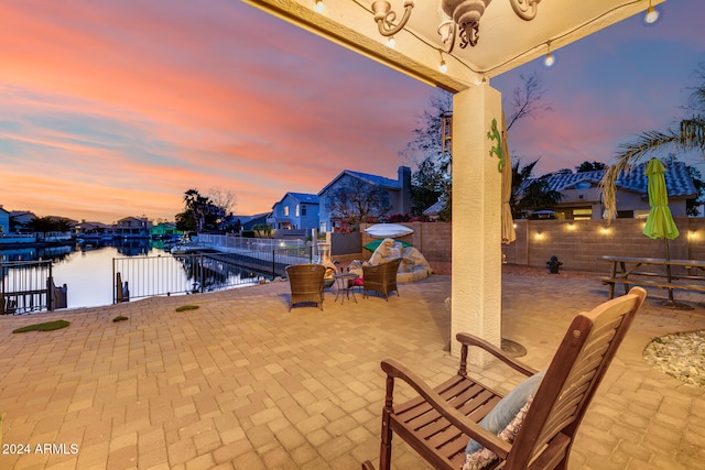 patio terrace at dusk with a water view