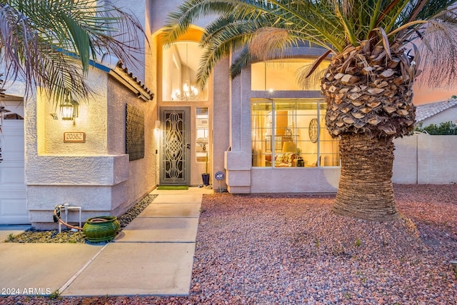 view of exterior entry with a garage