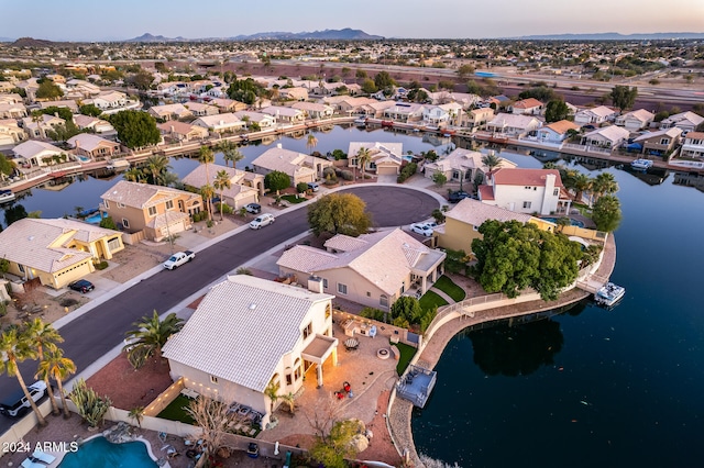 aerial view at dusk with a water view