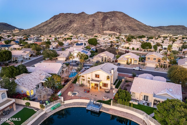 birds eye view of property with a mountain view