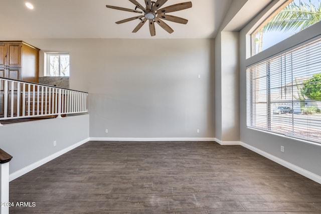 spare room with ceiling fan and dark hardwood / wood-style floors