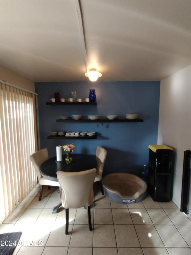 dining area with tile patterned flooring