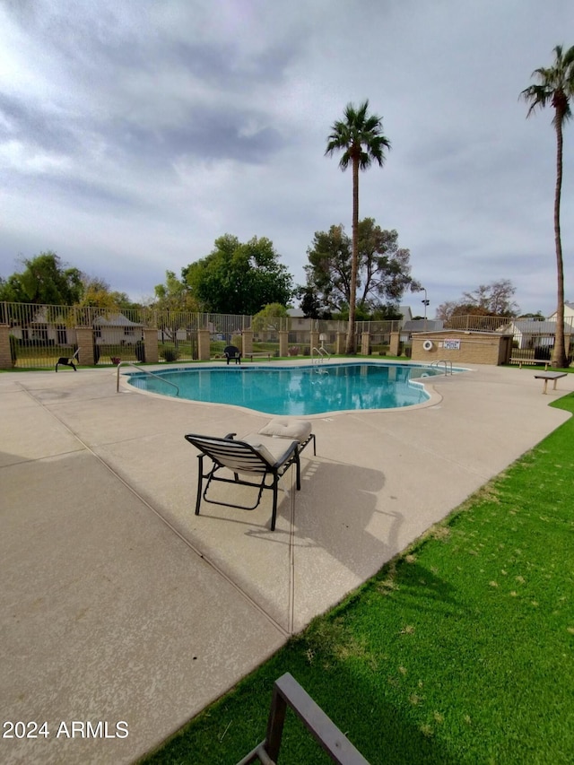 view of pool with a patio area