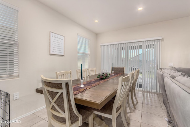 dining area with light tile patterned floors