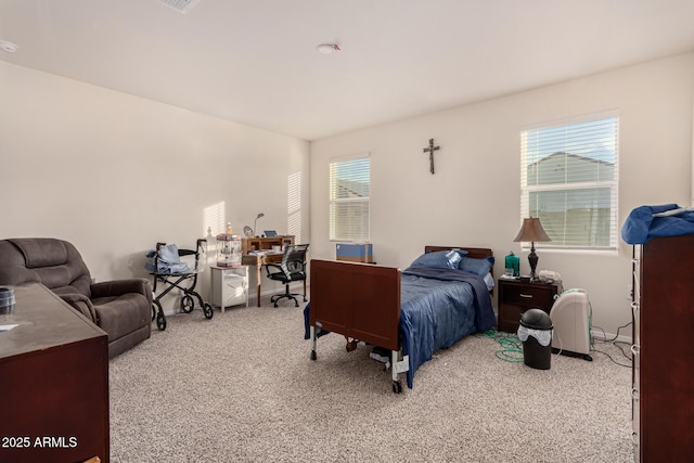 bedroom featuring light carpet