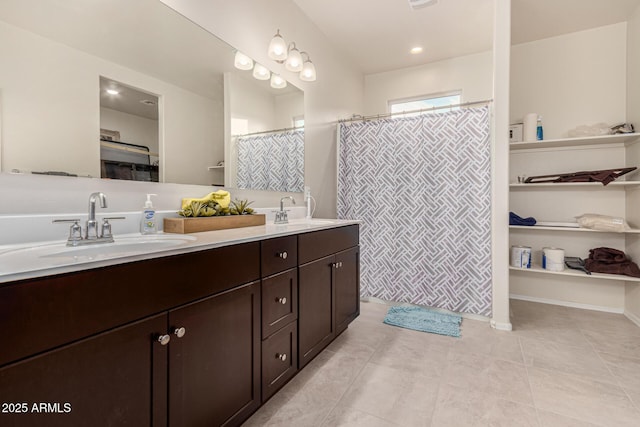 bathroom with vanity, tile patterned floors, and walk in shower