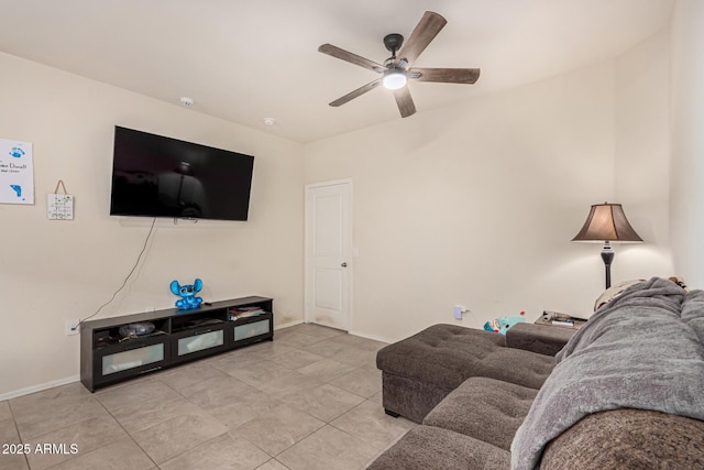 tiled living room featuring ceiling fan