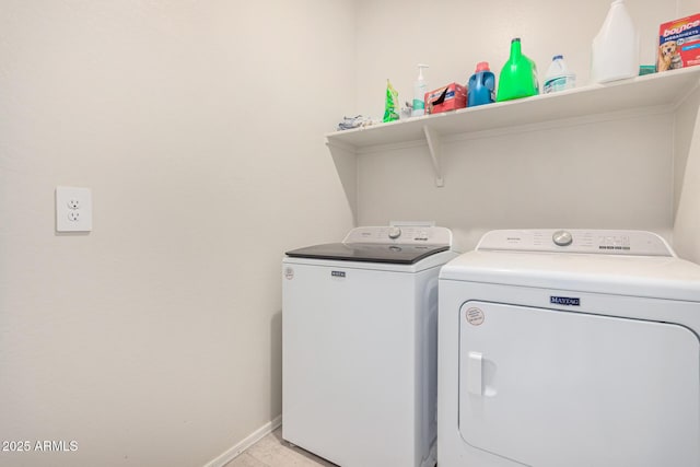 laundry area with washing machine and clothes dryer