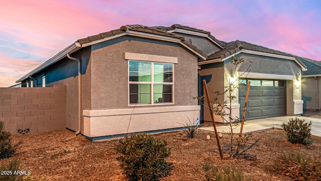 view of front of property featuring a garage