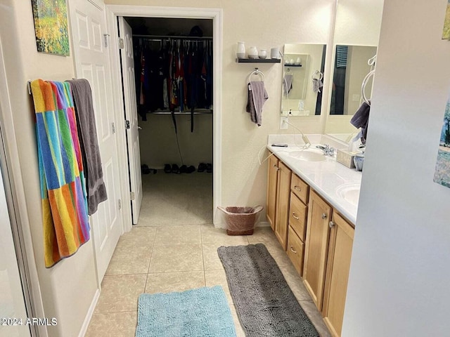 bathroom with tile patterned flooring and vanity