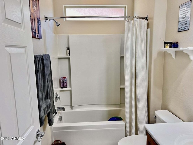 full bathroom with shower / bath combination with curtain, vanity, and toilet