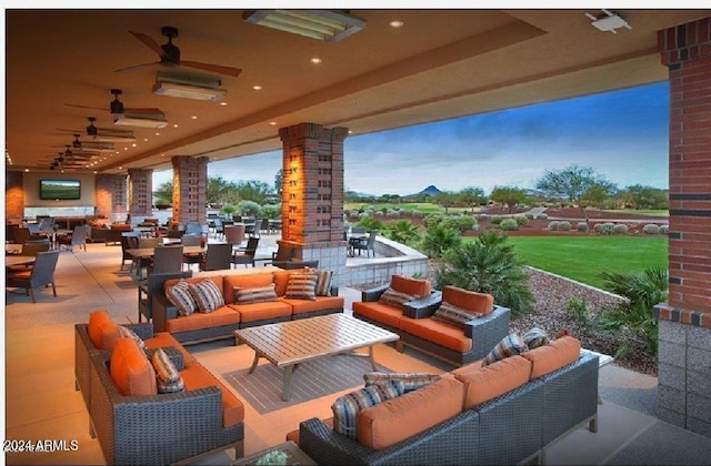 view of patio with ceiling fan and an outdoor living space