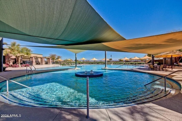 view of swimming pool featuring a patio area