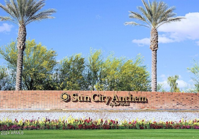 community / neighborhood sign with a lawn