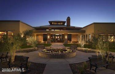 back house at dusk with a patio