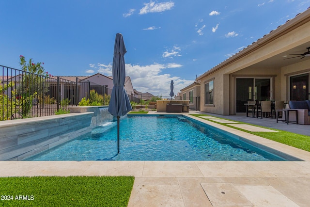 view of pool featuring a patio and ceiling fan