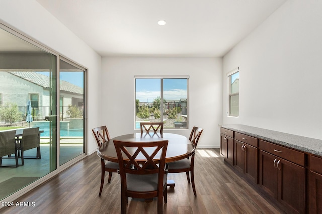 dining space featuring dark hardwood / wood-style floors