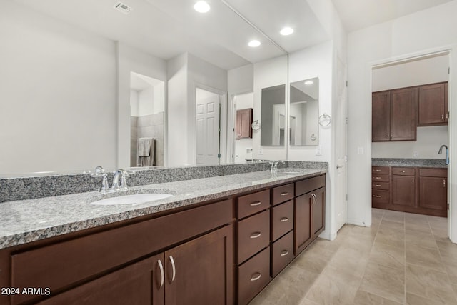 bathroom featuring tile patterned floors and vanity