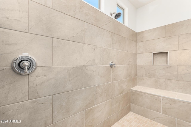 bathroom featuring tiled shower