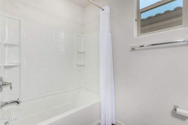 bathroom featuring shower / bath combination with curtain