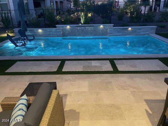 view of swimming pool featuring a patio area and pool water feature