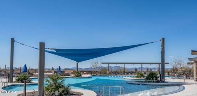 view of swimming pool with a patio