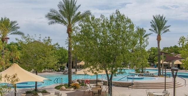 view of swimming pool with a patio area