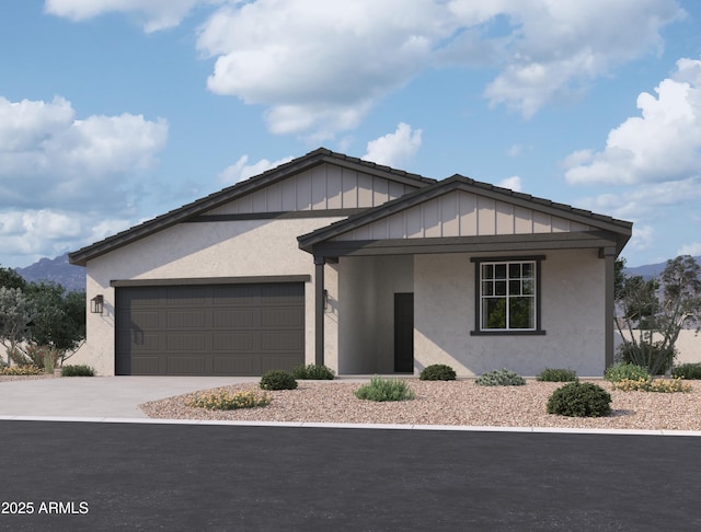 view of front of home with a garage, concrete driveway, and stucco siding