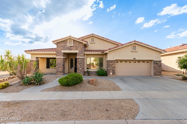 mediterranean / spanish-style house featuring a garage