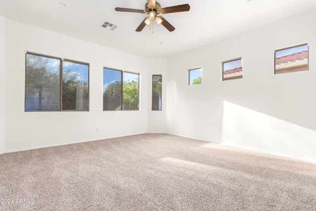 carpeted empty room with ceiling fan