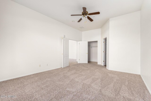 unfurnished bedroom with ceiling fan and carpet flooring