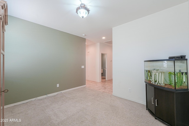 carpeted empty room with baseboards and recessed lighting