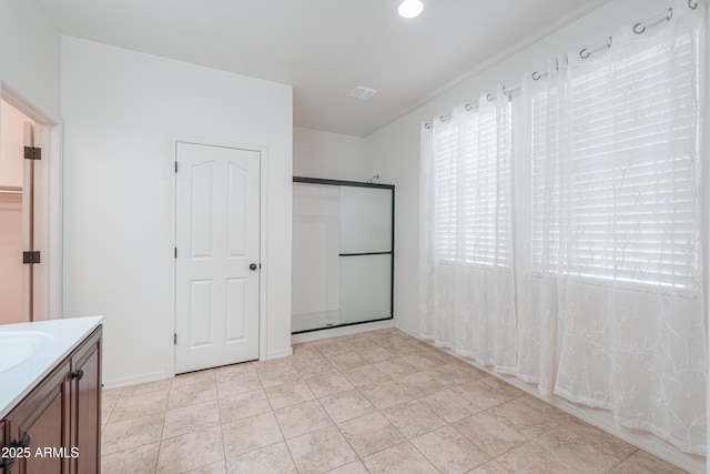 interior space with a sink and light tile patterned floors