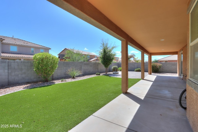 view of yard featuring a patio and a fenced backyard