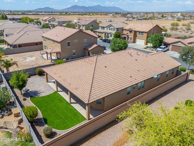 aerial view featuring a mountain view and a residential view