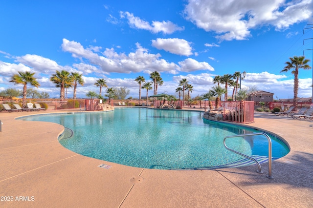 community pool with a patio