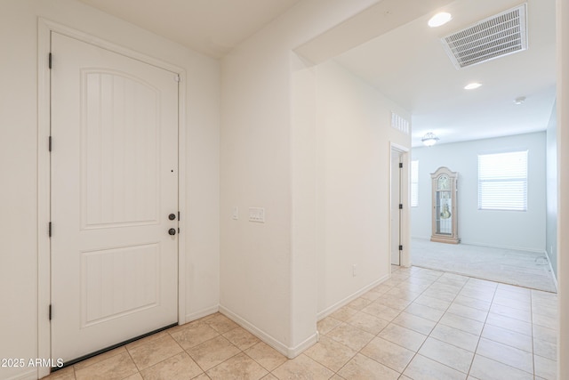 entrance foyer featuring light tile patterned floors, recessed lighting, baseboards, and visible vents
