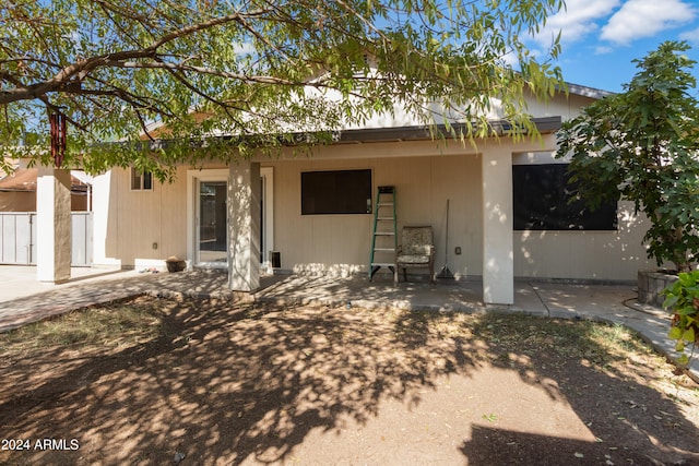 back of property featuring a patio area