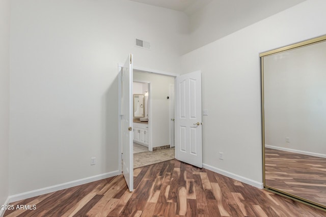 15009 E Palomino Blvd, Fountain Hills, AZ 85268 - unfurnished bedroom with wood finished floors and a closet