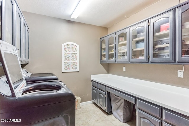 15009 E Palomino Blvd, Fountain Hills, AZ 85268 - washroom with cabinet space, washing machine and dryer, light tile patterned floors, and a textured ceiling
