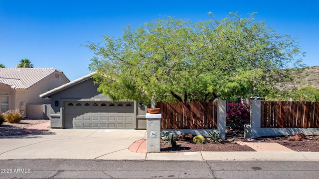 15009 E Palomino Blvd, Fountain Hills, AZ 85268 - view of front facade with an attached garage, concrete driveway, and stucco siding