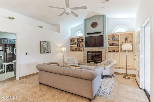15009 E Palomino Blvd, Fountain Hills, AZ 85268 - living area featuring high vaulted ceiling, ceiling fan, a tile fireplace, and light tile patterned floors