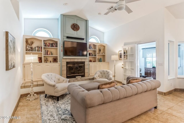 15009 E Palomino Blvd, Fountain Hills, AZ 85268 - living area featuring high vaulted ceiling, a ceiling fan, plenty of natural light, light tile patterned flooring, and a tile fireplace