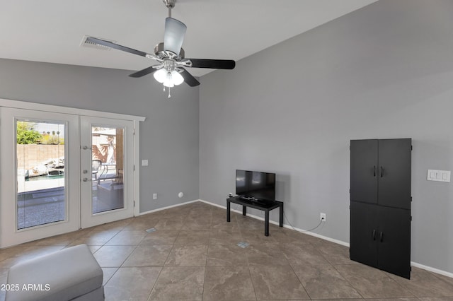 unfurnished living room with tile patterned flooring, visible vents, baseboards, french doors, and a ceiling fan