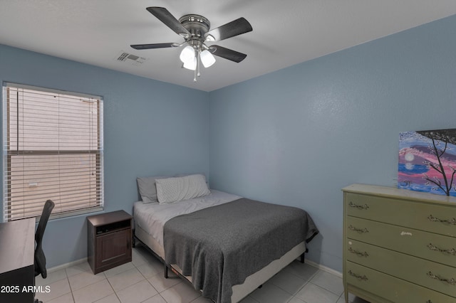 bedroom with ceiling fan, baseboards, visible vents, and light tile patterned floors