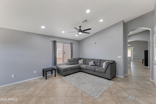 living area with arched walkways, a ceiling fan, recessed lighting, vaulted ceiling, and visible vents