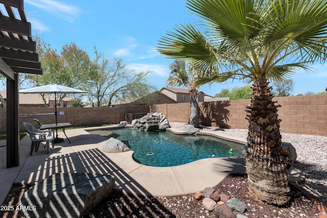view of swimming pool with a patio, a fenced in pool, and a fenced backyard