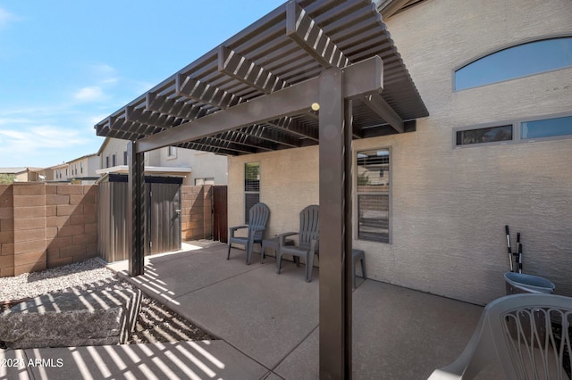 view of patio / terrace with fence and a pergola