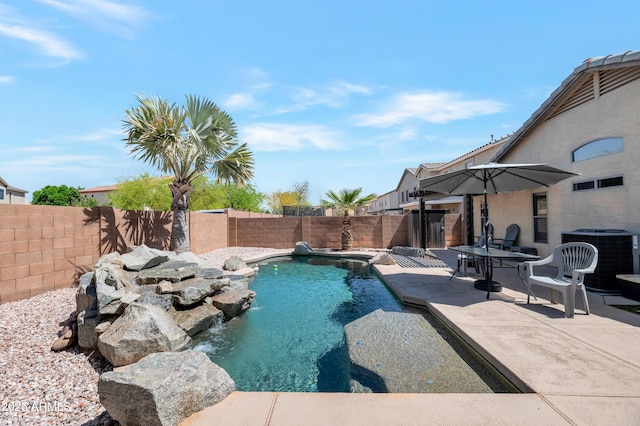 view of pool featuring a fenced backyard, a fenced in pool, cooling unit, and a patio